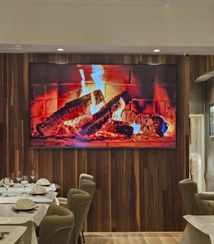 The fireplace wall in the Moti Mahal dining room
